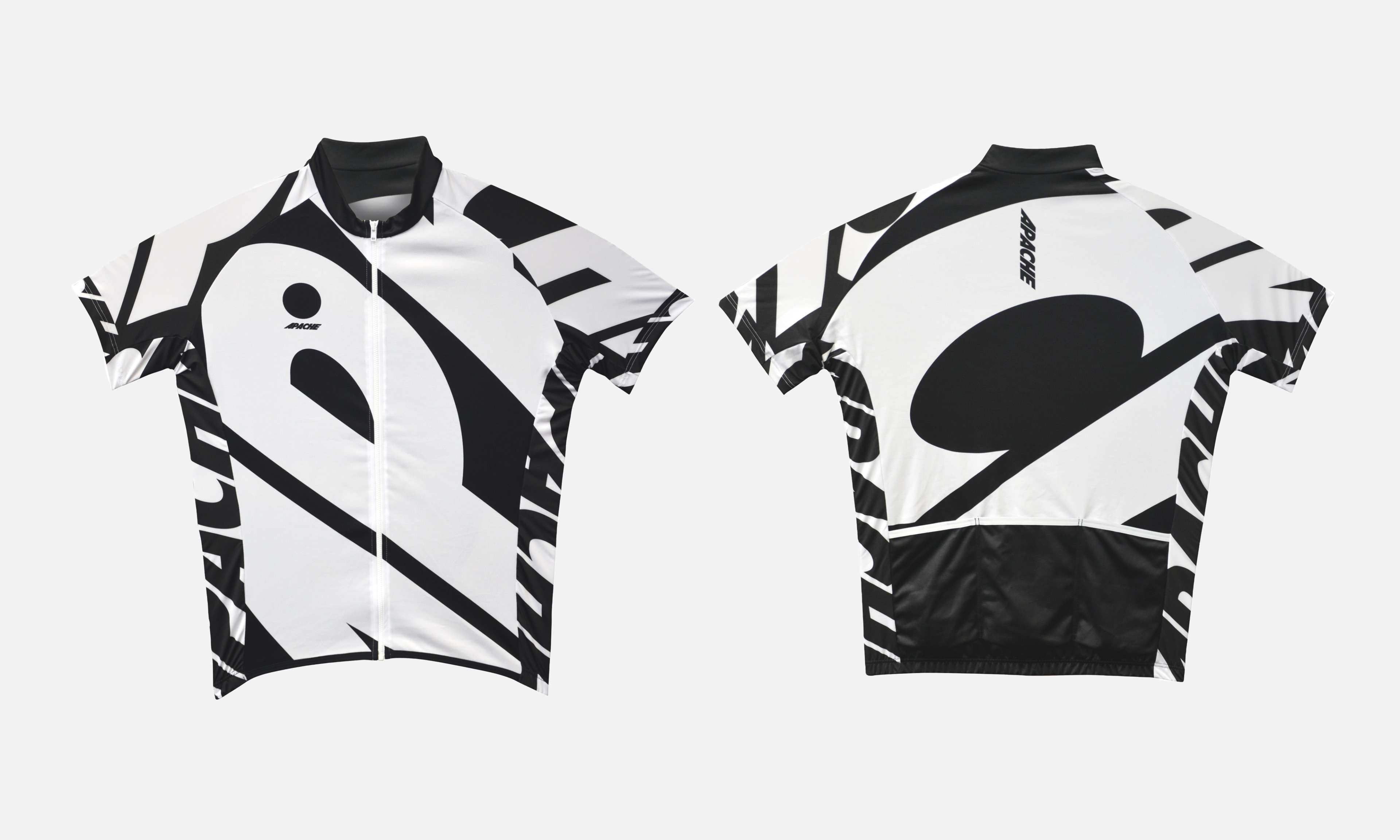 Front and back views of a black-and-white Apache-branded cycling jersey featuring a striking graphic pattern in the Speed Grotesk typeface. The minimalist layout and bold illustrations on the jersey capture Apache's new visual identity, blending vital visual elements with functional sportswear. This design reflects the brand's expressive typography focus, appealing to urban and adventure cyclists.