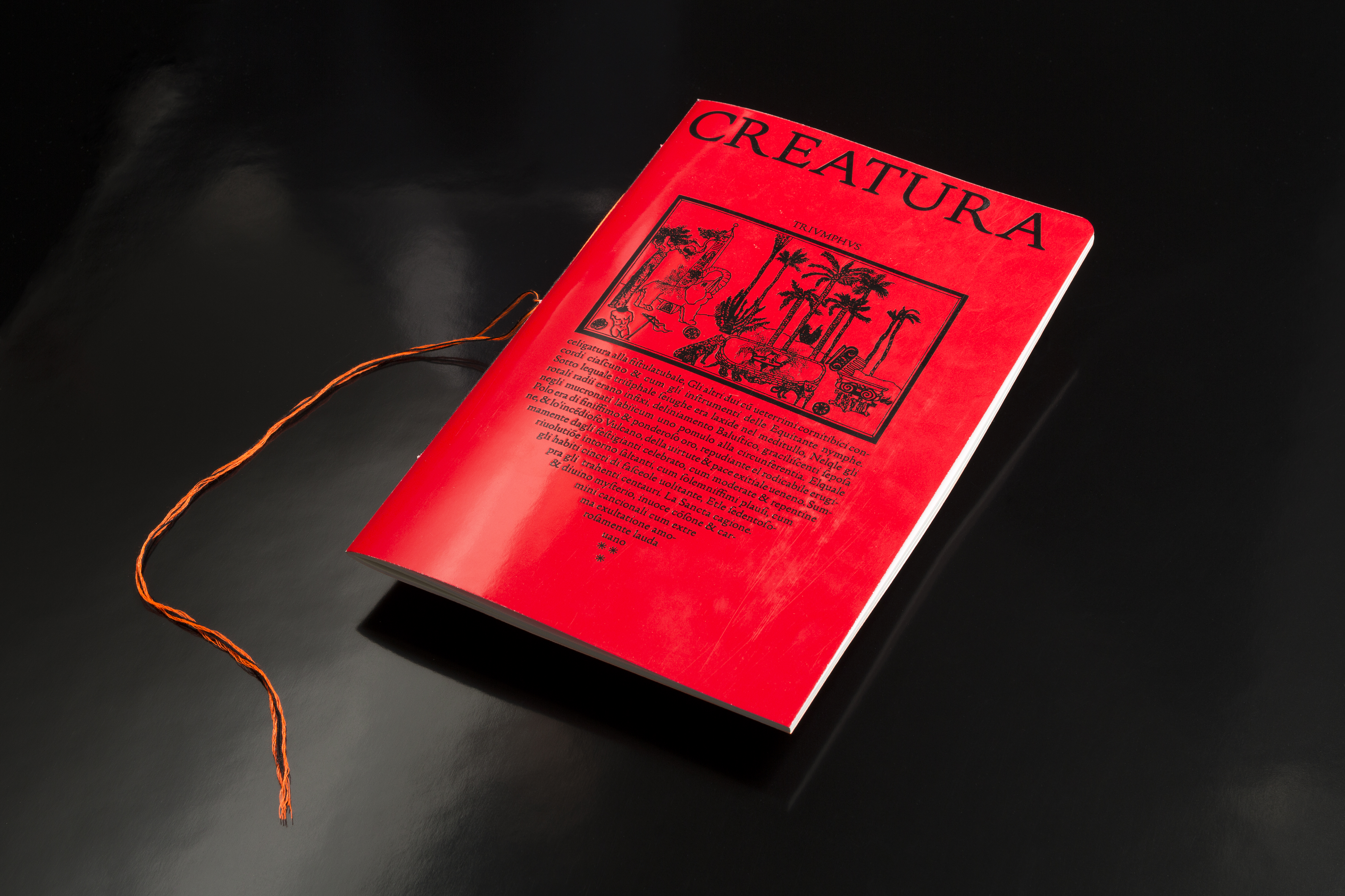 Creatura font specimen cover in vibrant red with intricate black illustrations inspired by the old book 